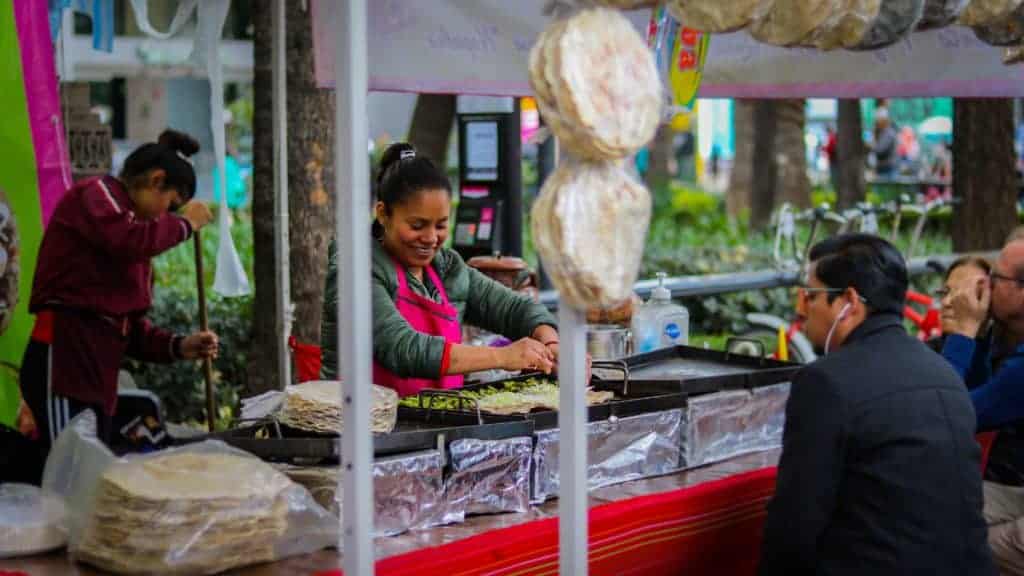 Lady making quesadillas in the market in Mexico City